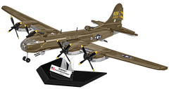 A detailed model of a Boeing B-29 Superfortress bomber airplane in olive drab military livery, mounted on a black display stand with a 'BOEING B-29 Superfortress' plaque.